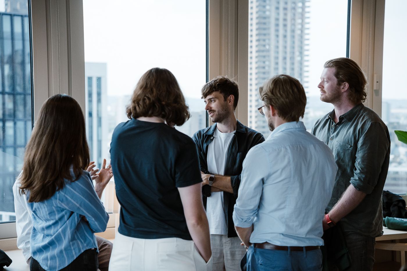 The Greenpixie team talking in the London office